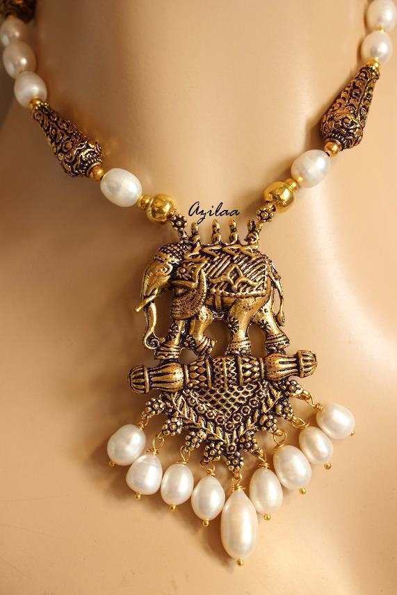 Antique gold tone elephant pendant pearl necklace earrings set