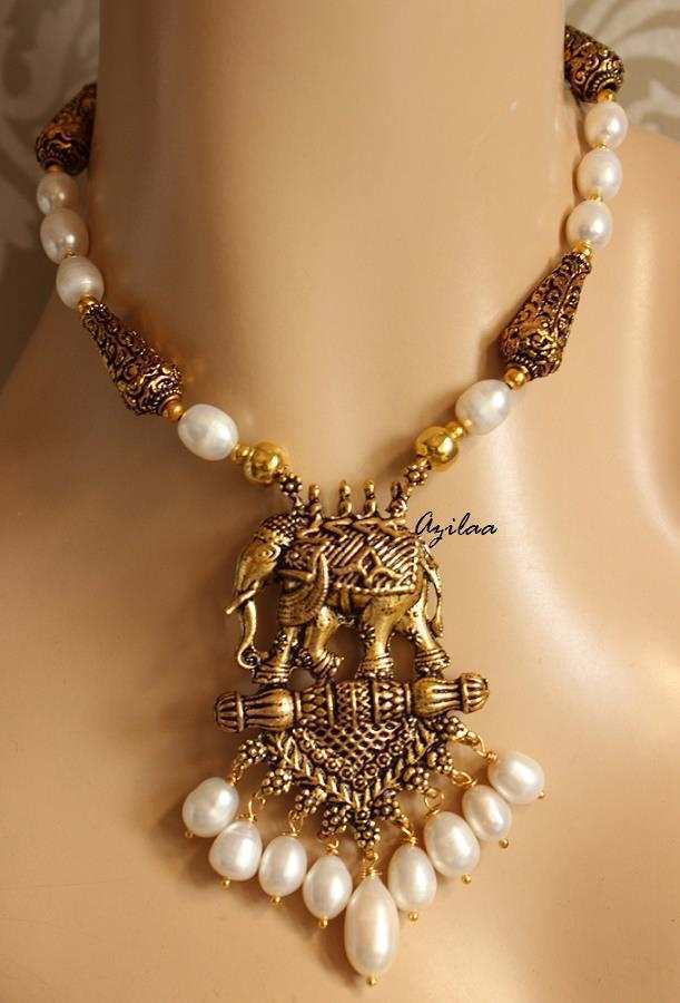 Antique gold tone elephant pendant pearl necklace earrings set