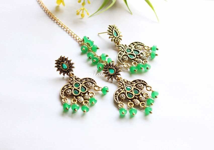 Beautiful green maang tikka gold tone earrings set