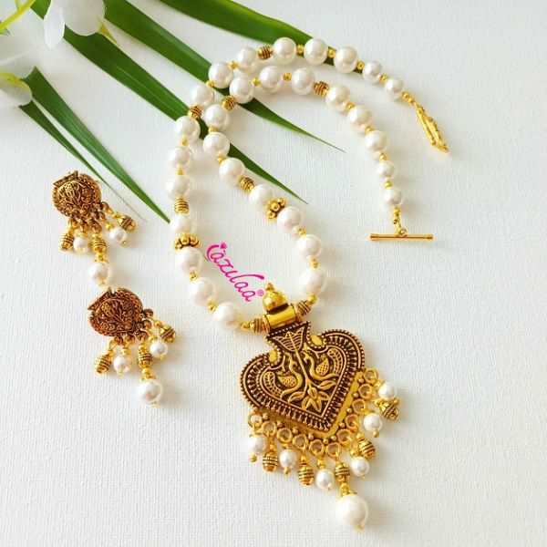 Ethnic Pearl designer golden necklace earrings set