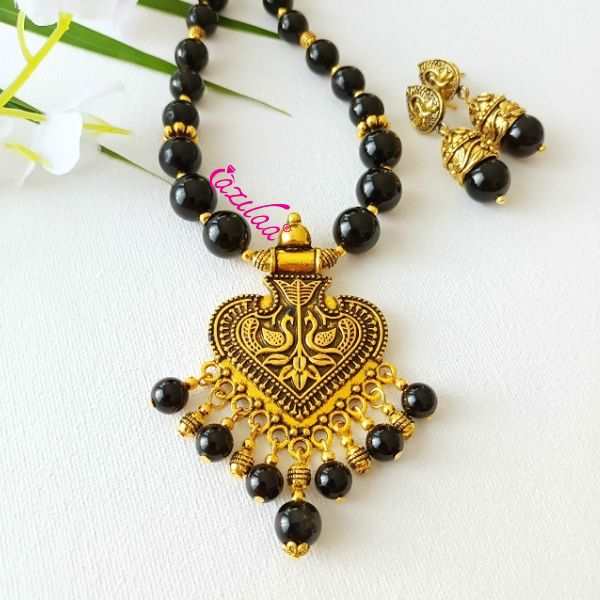 Ethnic black onyx designer golden necklace earrings set