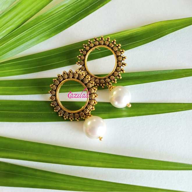 Golden pearl dangler statement earrings