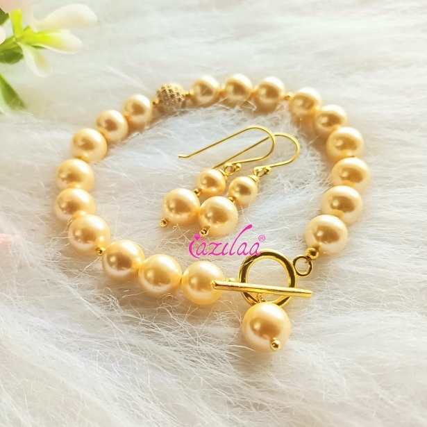 Golden Pearl designer bracelet earrings set