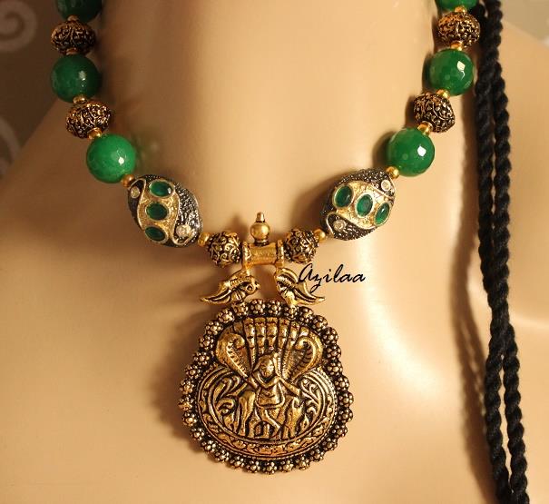Krishna pendant necklace set with green stone beads