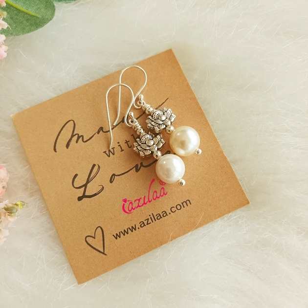 Lotus white pearl dangler silver tone charm earrings
