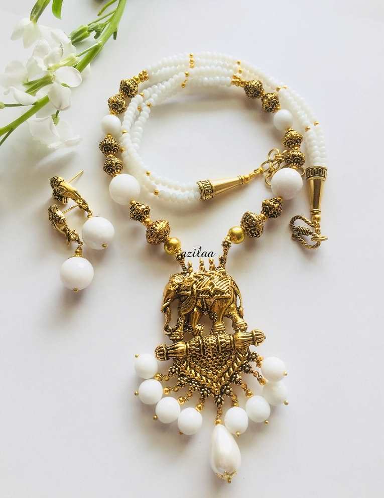 White antique gold tone elephant pendant necklace earrings set